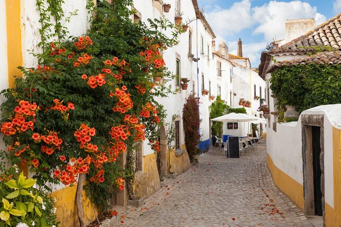 Fátima, Nazaré, and Óbidos: Small Group Tour From Lisbon - Fátima: pilgrimage architecture, the shepherd story, and a surprising Berlin Wall tie-in