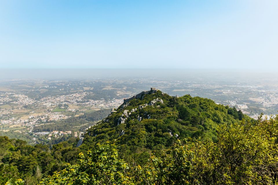 From Lisbon: Sintra & Cascais Small Group Tour with Tickets - Getting picked up in Lisbon and rolling out in a comfortable van