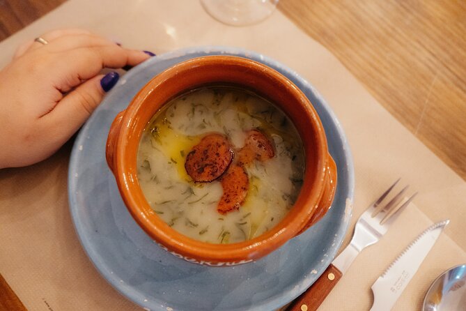 Heart of Lisbon Food Tour: Baixa, Chiado & Bairro Alto - Entering a former-church restaurant in Chiado for bifana and drinks