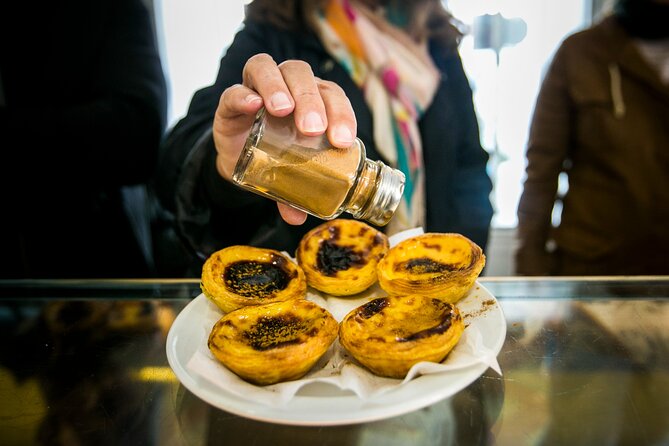 Lisbon Awakens: A Culinary Crossroads, Reborn. - Jardim da Parada: custard tarts with 19th-century tiles and shade