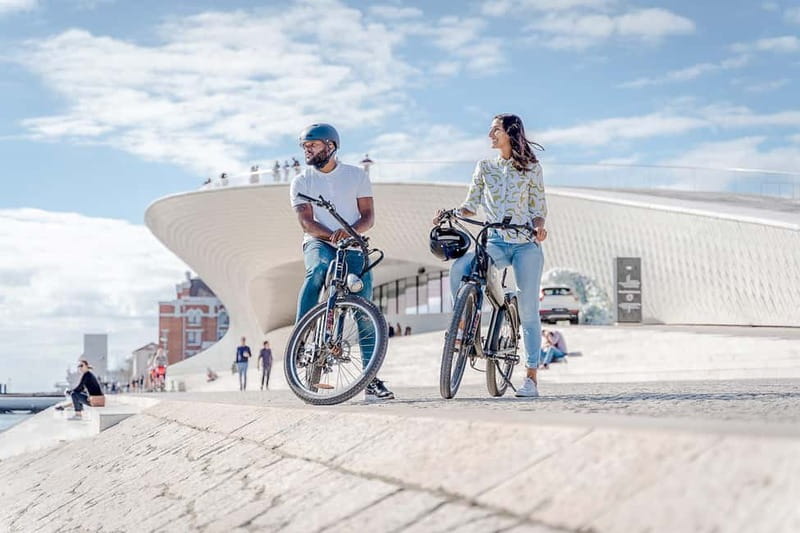 Lisbon: Electric Bike Tour by the River to Belém - Rolling into Alcântara: the dock area below 25 de Abril Bridge