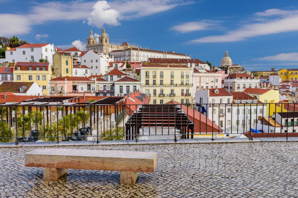 Lisbon: Hills Red Tram Tour by Tram 28 Route 24-Hour Ticket - Alfama and Mouraria: Narrow streets, big feeling, and tiled corners