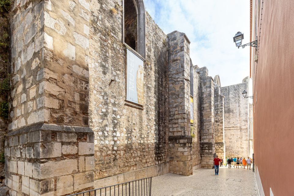 Lisbon: History, Stories and Lifestyle Walking Tour - Lisbon Cathedral ending: built in 1150, shaped by centuries