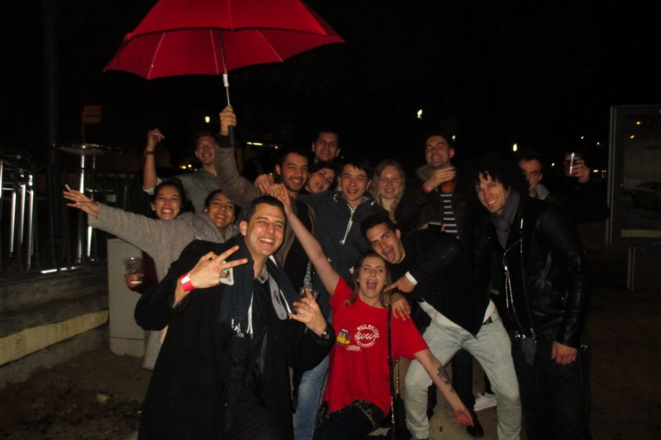 Lisbon: Pub Crawl with Open Bar and VIP Club Entry - Welcome shots, music shifts, and the games-and-dancing vibe
