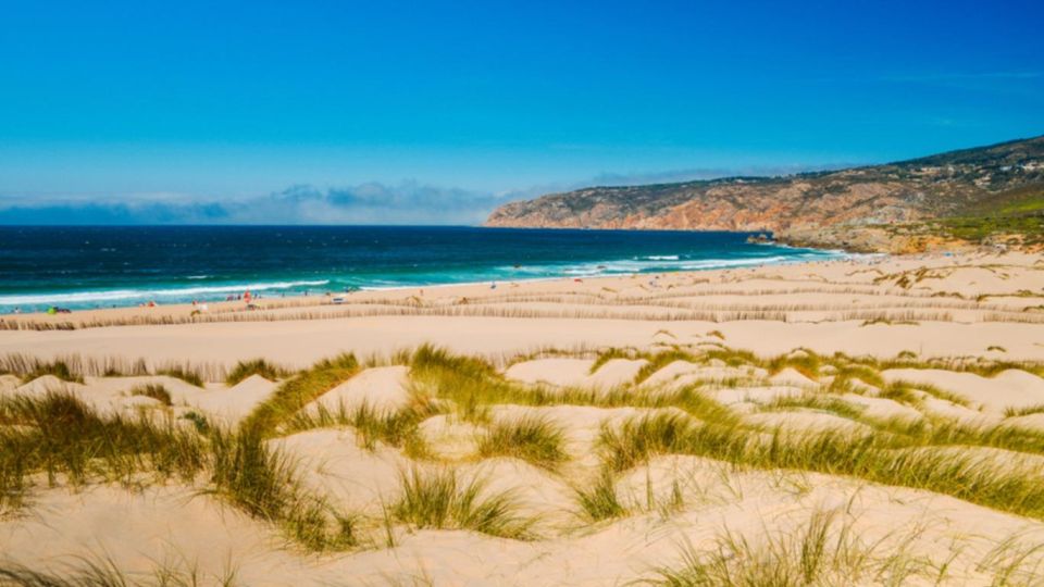 Lisbon: Sintra, Pena Palace, Cabo Roca Coast & Cascais Tour - Cabo Roca-style ocean views plus Guincho Beach: short stop, big payoff