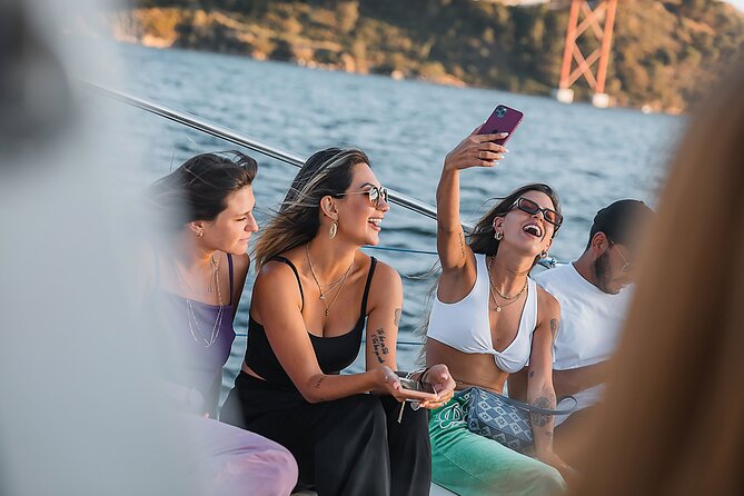 Lisbon: Sunset Catamaran Boat Tour with Music and Drinks - Drinks and music: how the included welcome drink changes the mood